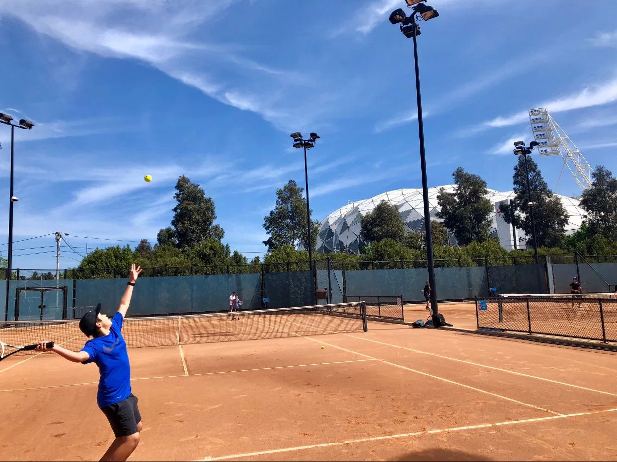 Gabe on the tennis court as a kid