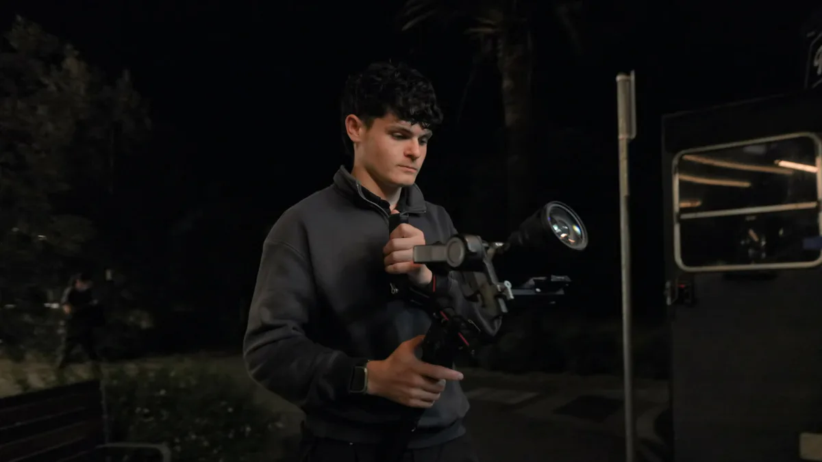 Jack on a gimbal rig at night on set