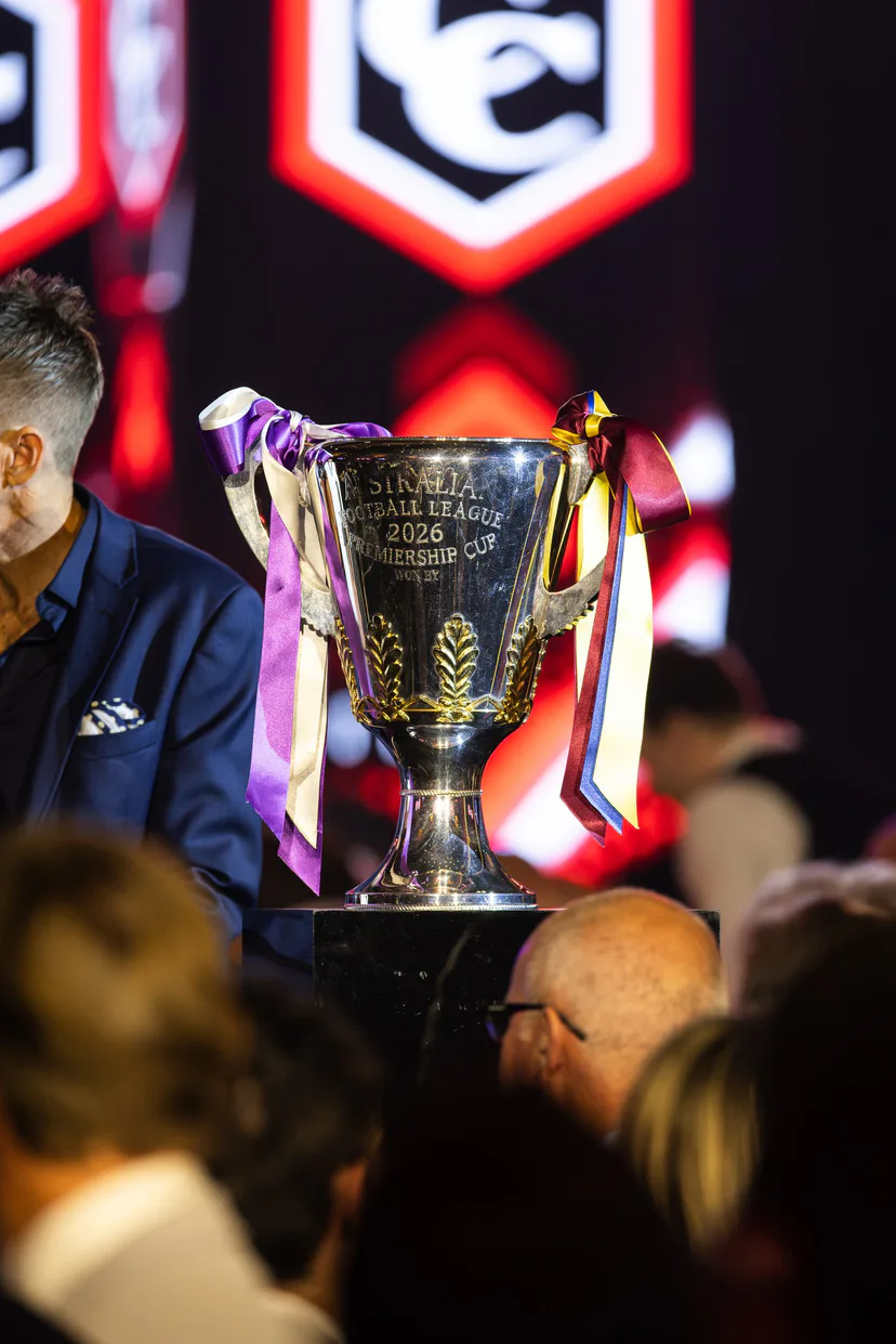 The premiership cup on stage with guests gathered around it