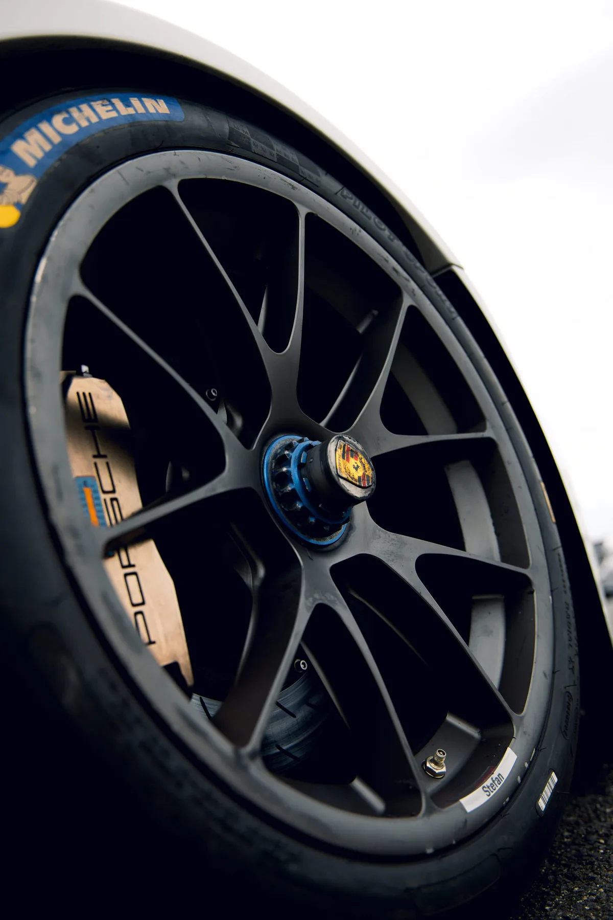 A Porsche wheel and tyre, close up.