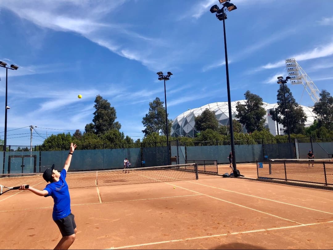 Gabe on the tennis court as a kid