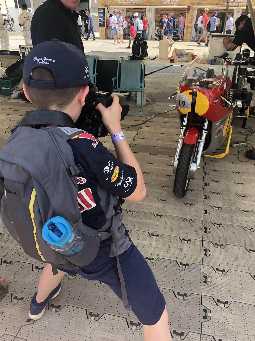 A young Jack shooting a race bike trackside