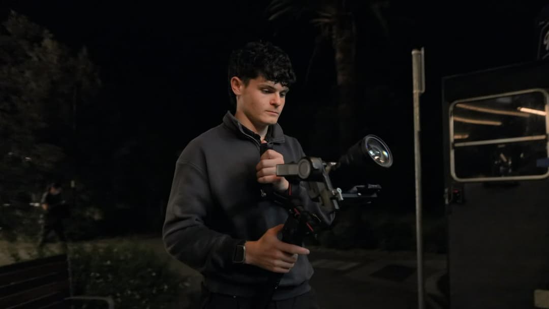 Jack on a gimbal rig at night on set
