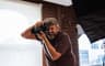 Kris Walters shooting on a mirrorless camera in a studio