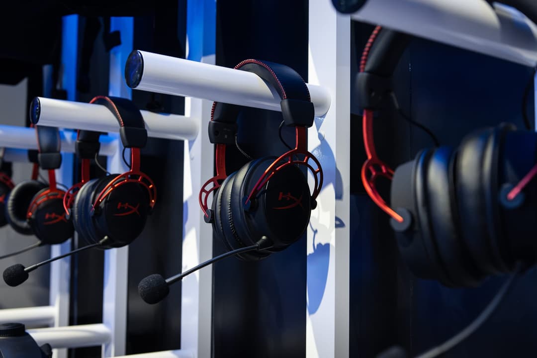 Gaming headsets hanging on hooks
