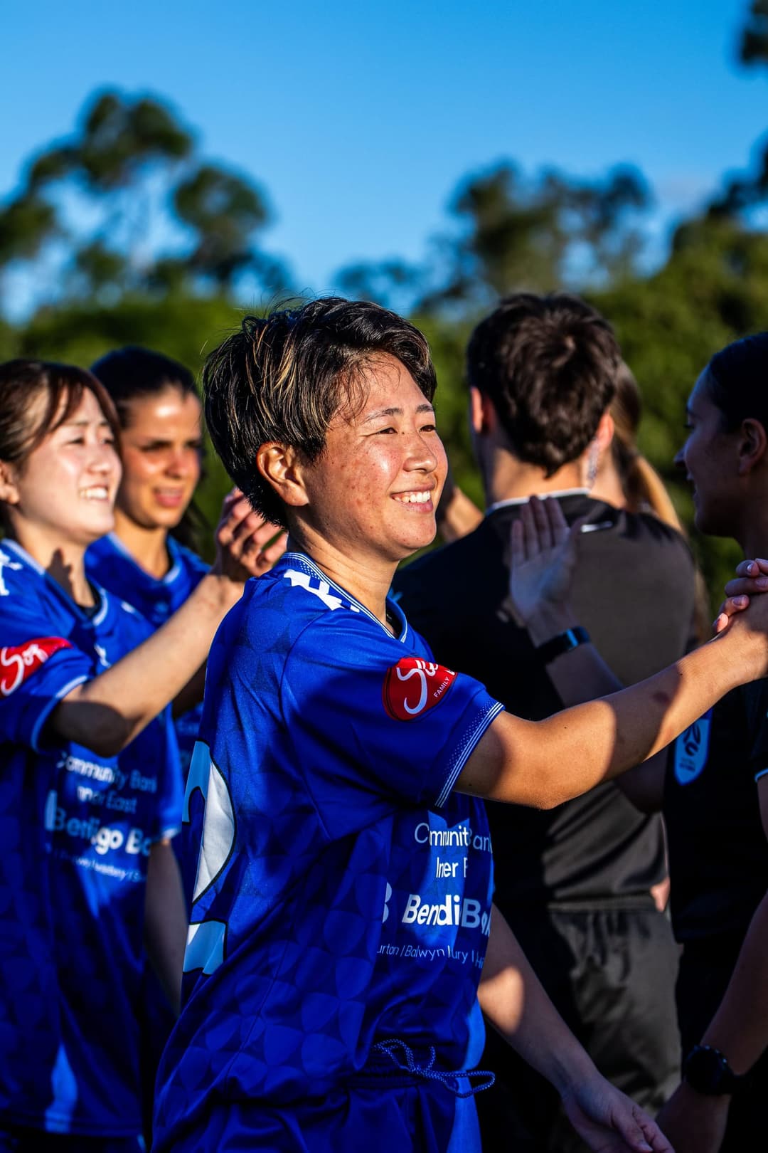 Box Hill United players shaking hands down the line before kick-off