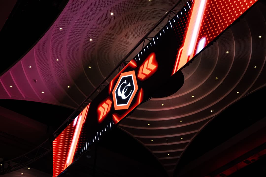 Carbine Club graphics on a screen hung from the ballroom ceiling