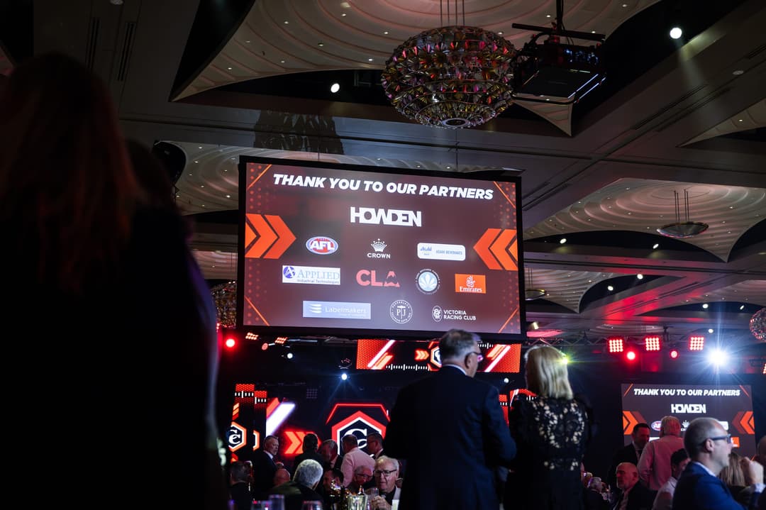 A thank you to our partners screen above the ballroom